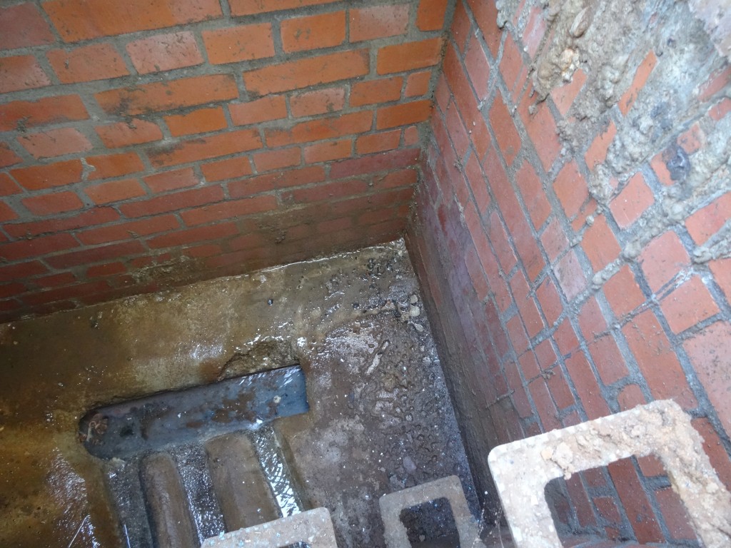 Leaking water entering manhole