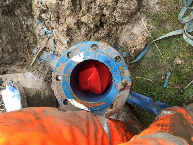 Water bill validation - water meter with red plastic cap inside - H2O Building Services 